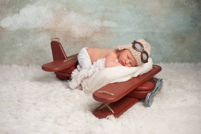 Baby sleeping on a small airplane