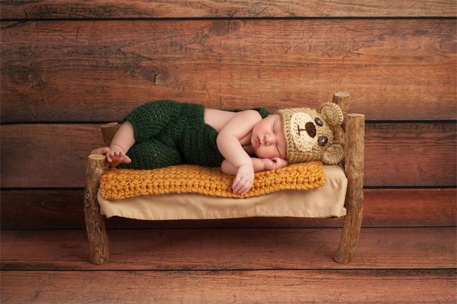 Baby on a Miniature Bed