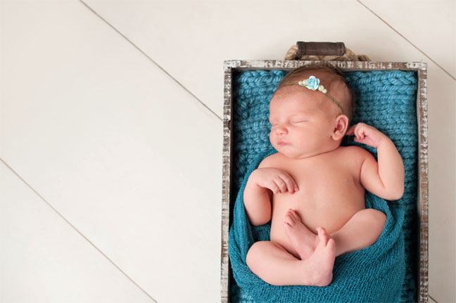 Baby in a Wooden Crate